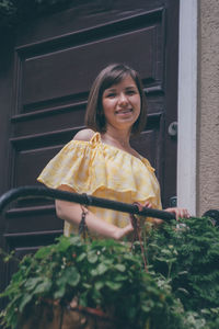 Portrait of a smiling girl standing outdoors