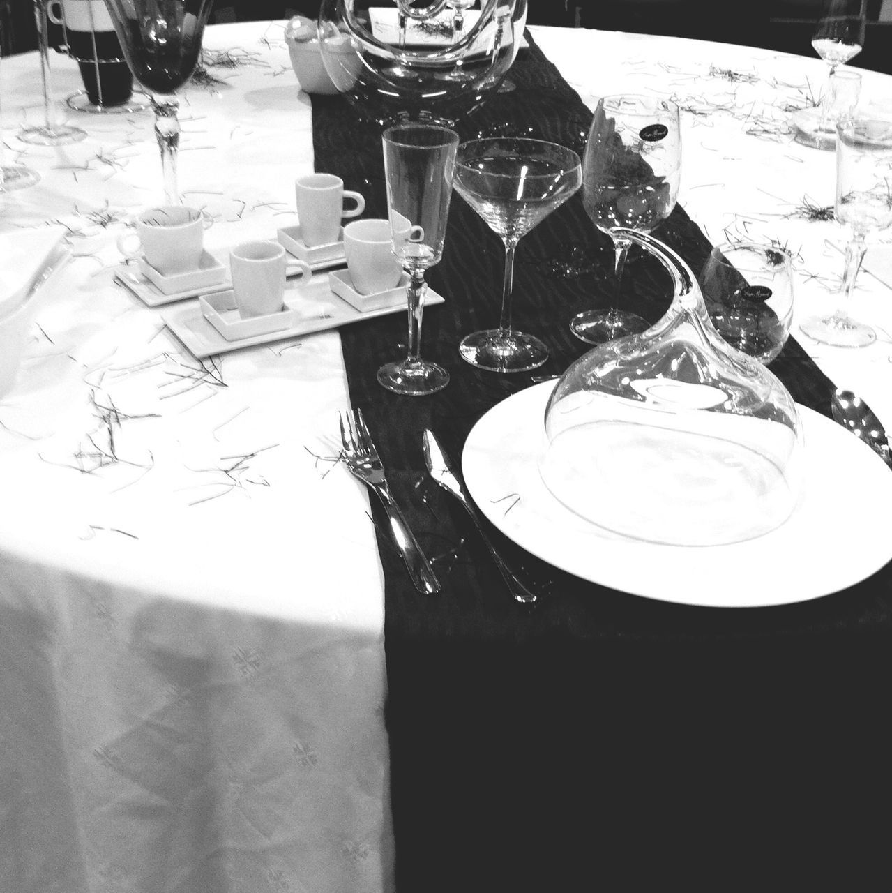 table, indoors, drink, still life, wineglass, drinking glass, refreshment, food and drink, glass - material, close-up, high angle view, bottle, restaurant, wine, alcohol, shadow, no people, empty, transparent, reflection