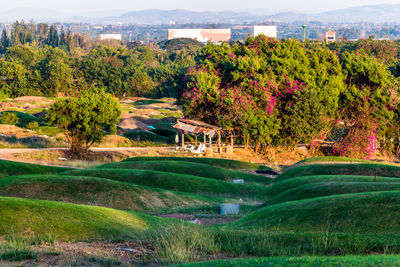 Scenic view of golf course against sky