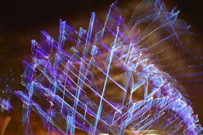 Low angle view of illuminated lights at night