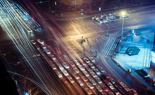 High angle view of light trails on road at night