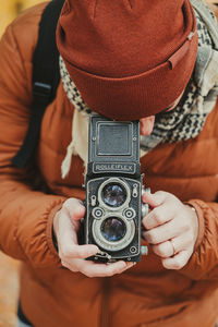 Midsection of woman photographing