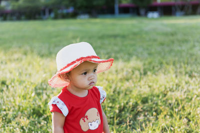 Portrait of boy standing on field