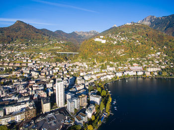 High angle view of townscape and mountains against sky