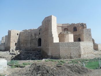 Low angle view of old building against clear sky