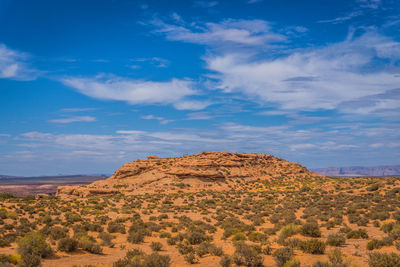 Scenic view of rocky mountains against blue sky