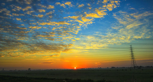 Scenic view of landscape at sunset