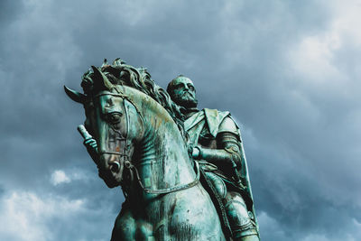 Low angle view of statue against sky