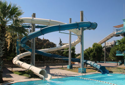 View of swimming pool against clear blue sky