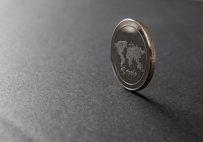 Close-up of coin on table