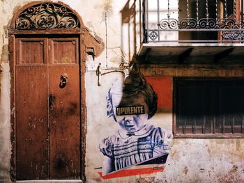 Graffiti on door of building