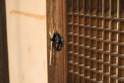 Close-up of wooden ajar door
