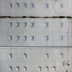 Aerial view of the flat roof of an industrial hall, as background