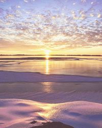 Scenic view of sea against sky at sunset