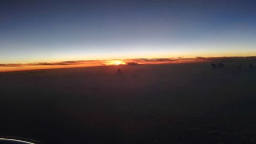 Scenic view of silhouette landscape against sky during sunset