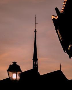 Low angle view of silhouette building against sky during sunset