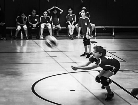 GROUP OF PEOPLE PLAYING WITH TOY