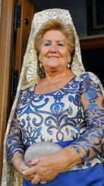 Portrait of smiling senior woman in dress