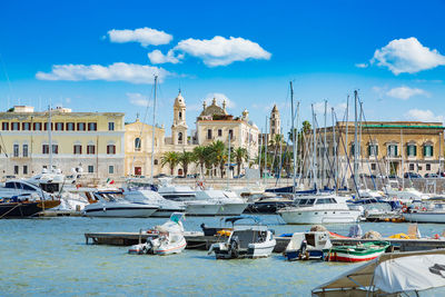 Boats moored at harbor