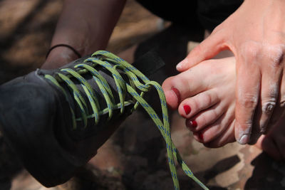 Close-up of man holding hands