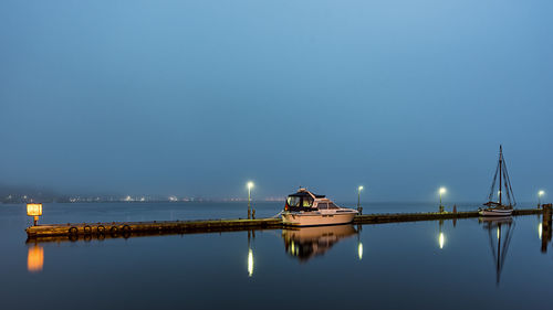 Scenic view of sea against clear sky at night