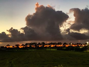 Scenic view of field against sky during sunset