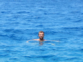 Portrait of man swimming in sea