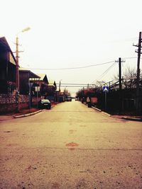 Road in city against clear sky