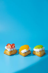 High angle view of cake against blue background