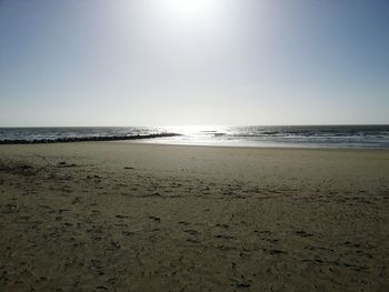 Scenic view of beach against clear sky