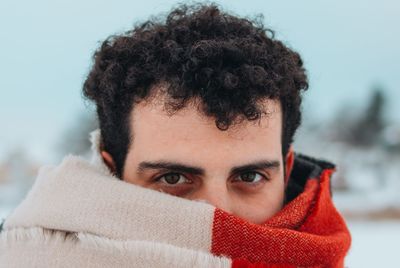 Close-up portrait of woman in winter