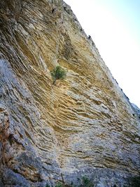 Low angle view of rock formation against clear sky