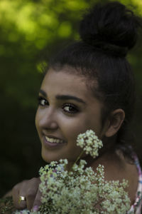 Portrait of young woman smiling