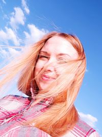 Portrait of woman against sky