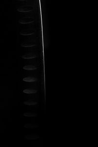 Close-up of tire track over black background