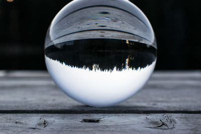 Close-up of crystal ball on pier