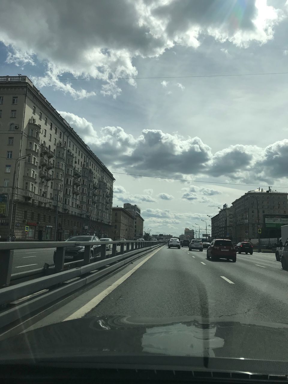 ROAD AGAINST SKY SEEN THROUGH GLASS