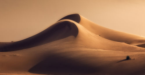 Scenic view of desert against clear sky