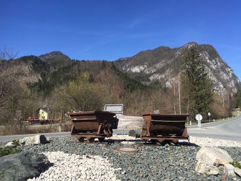 Scenic view of rocky mountains against blue sky