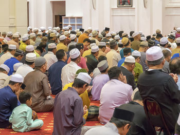 Group of people sitting in temple