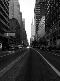 Road in city against clear sky