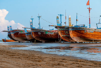 Boats moored at beach