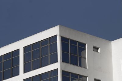 Low angle view of building against clear blue sky