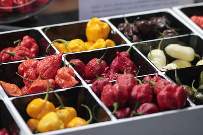 Spicy chili peppers of various colors, sold at market