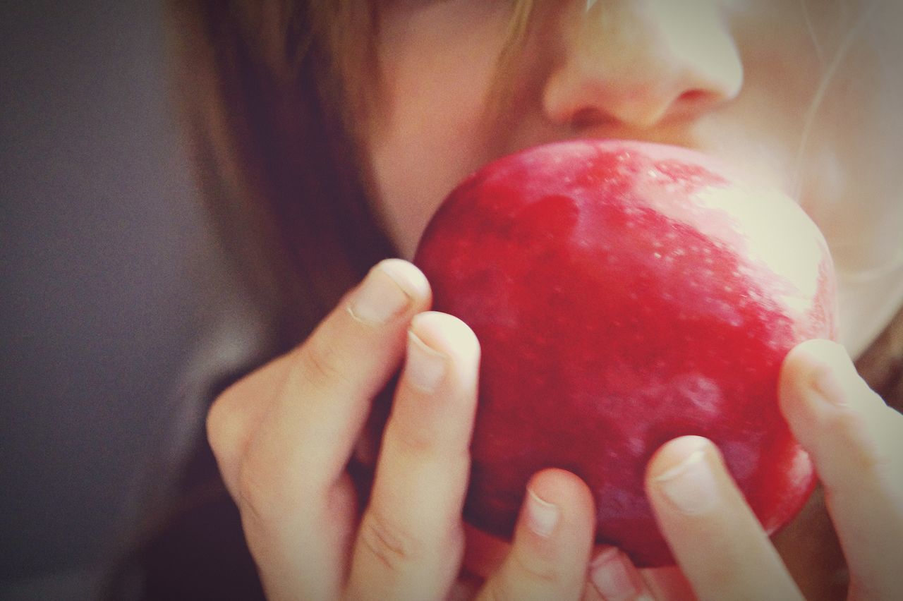 person, holding, part of, indoors, human finger, cropped, red, close-up, lifestyles, food and drink, unrecognizable person, freshness, sweet food, personal perspective, nail polish, food