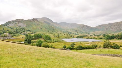 Scenic view of landscape and mountains against sky