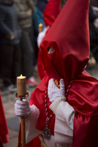 Person in traditional clothing marching on street