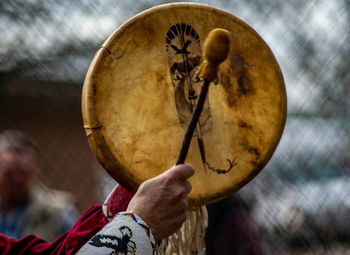 Close-up of man playing guitar