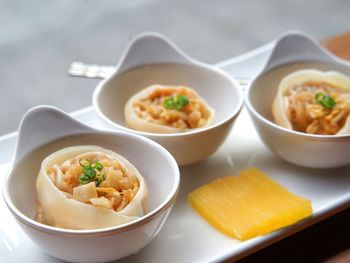 Close-up of fresh food in white bowls