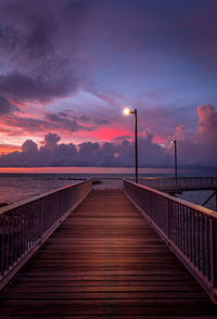View of bridge over sea during sunset